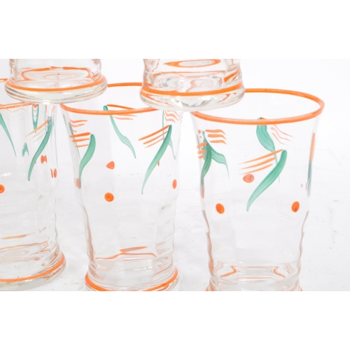 61 - A vintage mid 20th century lemonade set. With hand painted jug and with five drinking tumblers / gla... 