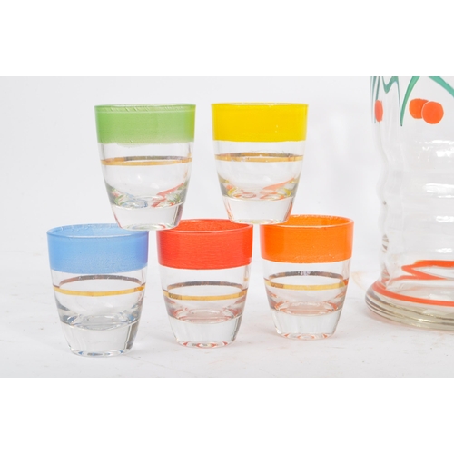 61 - A vintage mid 20th century lemonade set. With hand painted jug and with five drinking tumblers / gla... 