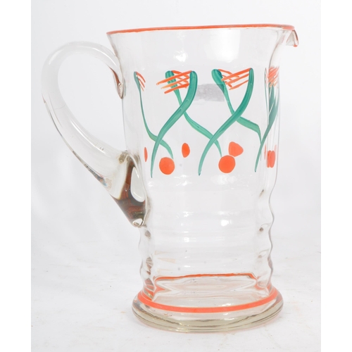 61 - A vintage mid 20th century lemonade set. With hand painted jug and with five drinking tumblers / gla... 