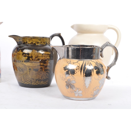 62 - A collection of five early 19th Century and later ceramic ware pottery jugs.With hand painted floral... 