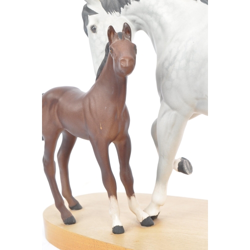 67 - Beswick - Spirit of Affection - A 20th century Beswick porcelain horse group figure modeled in the f... 