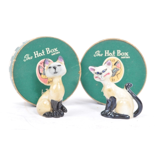 76 - Wade of England - A collection of 20th century porcelain cat figures. Including Wade of England Lady... 