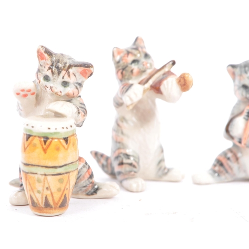 76 - Wade of England - A collection of 20th century porcelain cat figures. Including Wade of England Lady... 