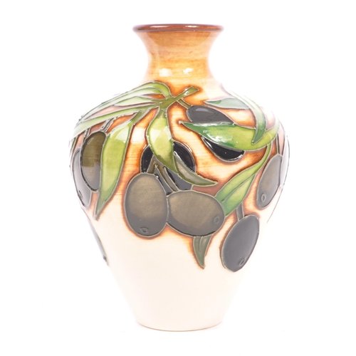 77 - Moorcroft Pottery - A contemporary 21st century ceramic hand painted Moorcroft vase. An 'Olives' vas... 