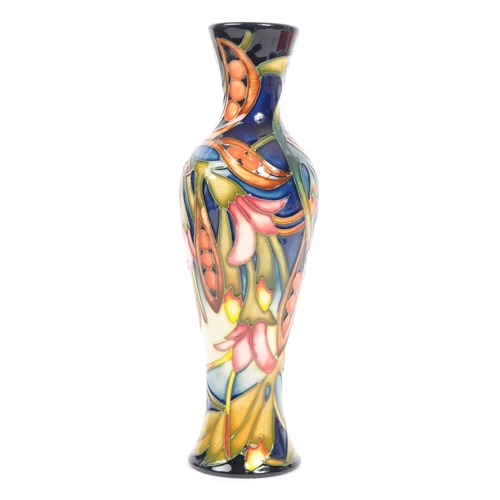 81 - Moorcroft Pottery - A contemporary 21st century ceramic hand painted Moorcroft vase. A 'Black Bean' ... 