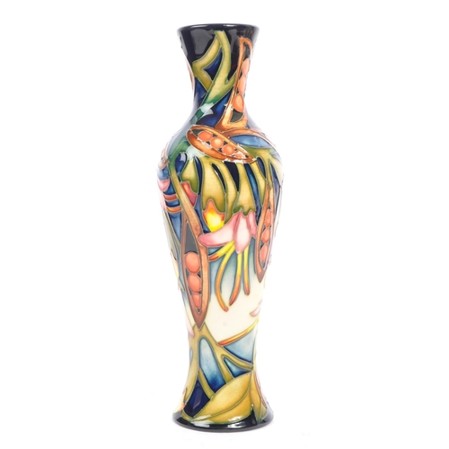 81 - Moorcroft Pottery - A contemporary 21st century ceramic hand painted Moorcroft vase. A 'Black Bean' ... 