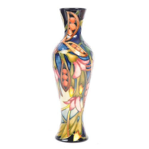 81 - Moorcroft Pottery - A contemporary 21st century ceramic hand painted Moorcroft vase. A 'Black Bean' ... 