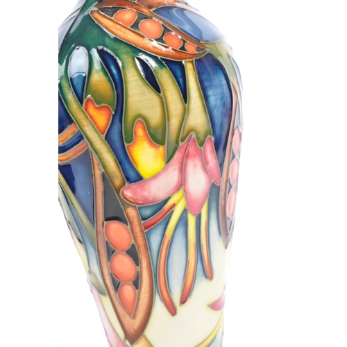 81 - Moorcroft Pottery - A contemporary 21st century ceramic hand painted Moorcroft vase. A 'Black Bean' ... 