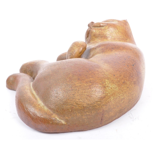 89 - A collection of three large mid 20th century studio pottery cat figures. The collection to include a... 