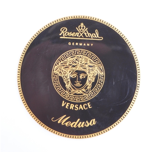 91 - A Rosenthal Germany for Versace large porcelain wall plate charger. The plate concentric rings of re... 