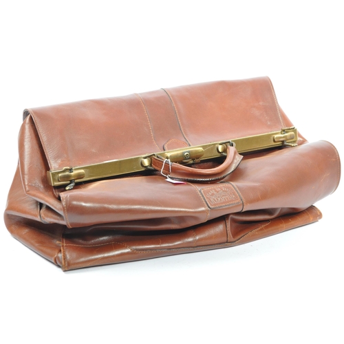 229 - A collection of three vintage 20th century circa 1940s leather Gladstone medical bags. Comprising of... 