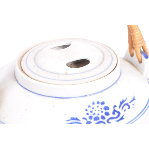 118 - A large early 20th century Chinese oversized teapot. White ground with central design of factory and... 