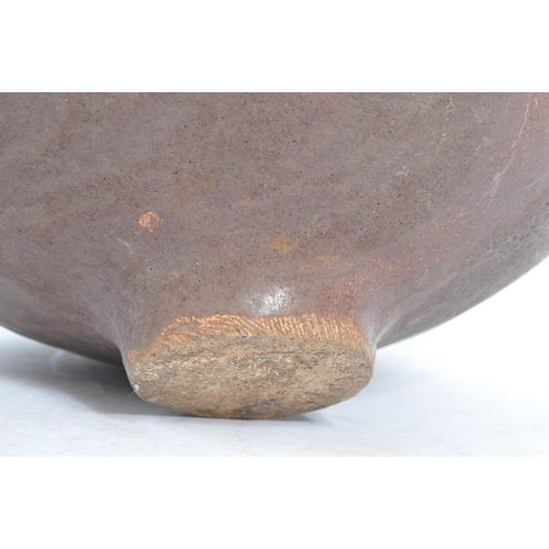 120 - A large mid 20th century brutalist narrow neck studio pottery vase. Of squat stone glaze form with t... 