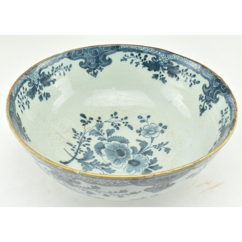 104 - An English believed 18th century hand painted blue & white Delft ceramic bowl. The bowl having flora... 