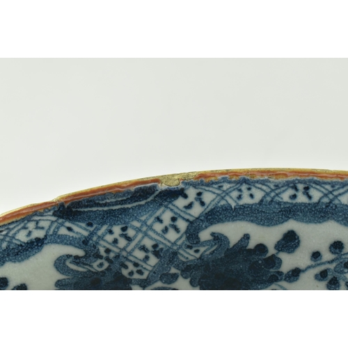 104 - An English believed 18th century hand painted blue & white Delft ceramic bowl. The bowl having flora... 