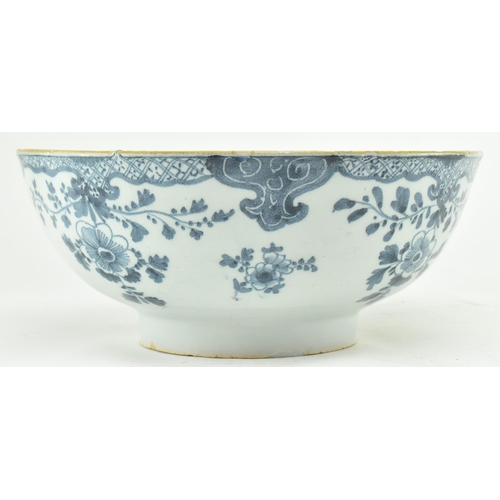 104 - An English believed 18th century hand painted blue & white Delft ceramic bowl. The bowl having flora... 