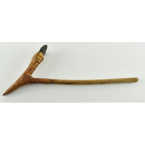 107 - A Papua New Guinea small tribal adze axe. The axehead of stone, in rattan V shaped mount with a wood... 