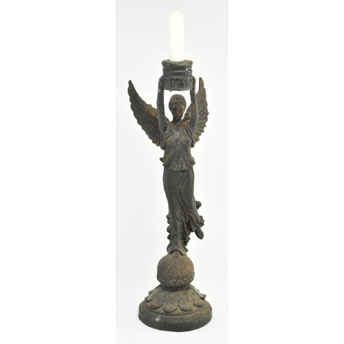 112 - A Victorian 19th century Grand Tour style bronze candlestick holder in the shape of The Winged Victo... 