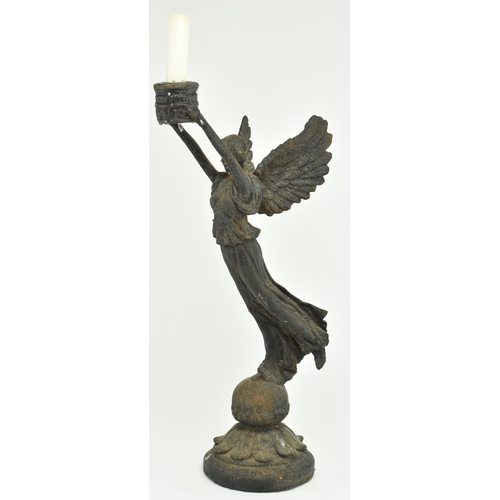 112 - A Victorian 19th century Grand Tour style bronze candlestick holder in the shape of The Winged Victo... 