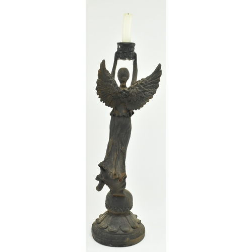 112 - A Victorian 19th century Grand Tour style bronze candlestick holder in the shape of The Winged Victo... 