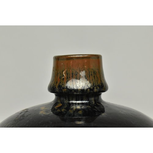 125 - A Chinese Kangxi period mirror-black glazed pottery vase. The vase with an ovoid body sweeping up fr... 