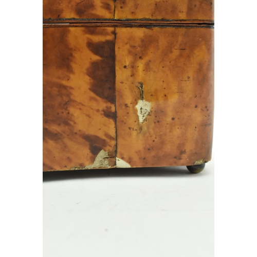 135 - A Regency early 19th century tortoiseshell veneered tea caddy box. The caddy having a chamfered top ... 