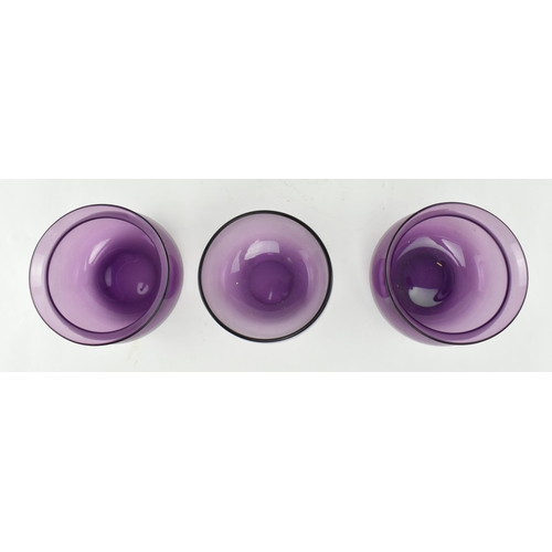 139 - A pair of early 19th century amethyst finger bowls, along with another similar example. Each bowl of... 