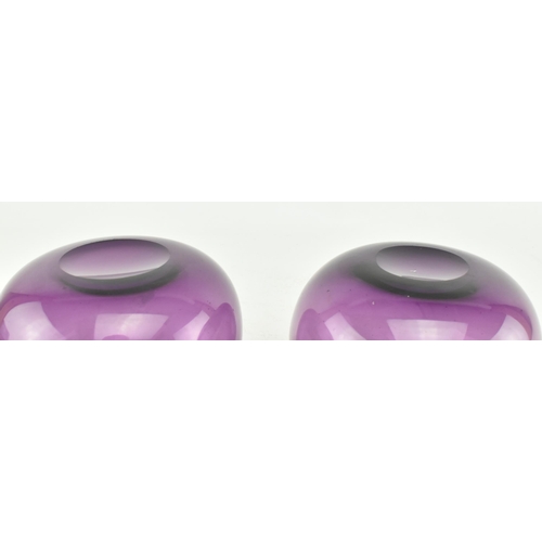 139 - A pair of early 19th century amethyst finger bowls, along with another similar example. Each bowl of... 