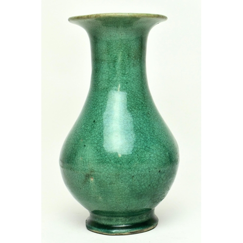 14 - A Chinese late Qing Dynasty early 19th century green glazed ceramic footed vase. The vase of baluste... 