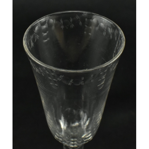 147 - A George III late 18th century hand blown ale drinking glass. The glass having a funnel bowl with et... 