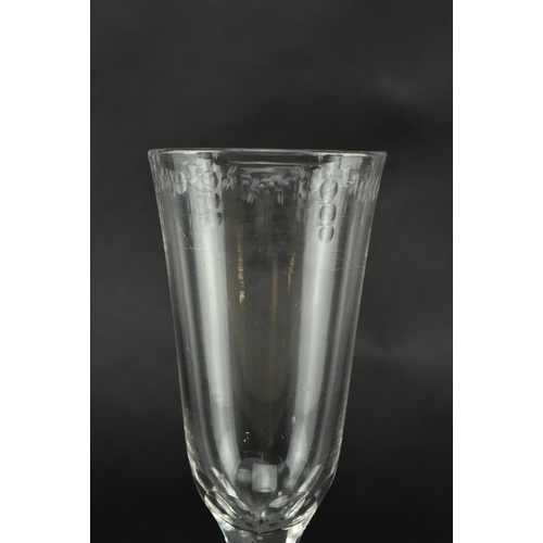 147 - A George III late 18th century hand blown ale drinking glass. The glass having a funnel bowl with et... 