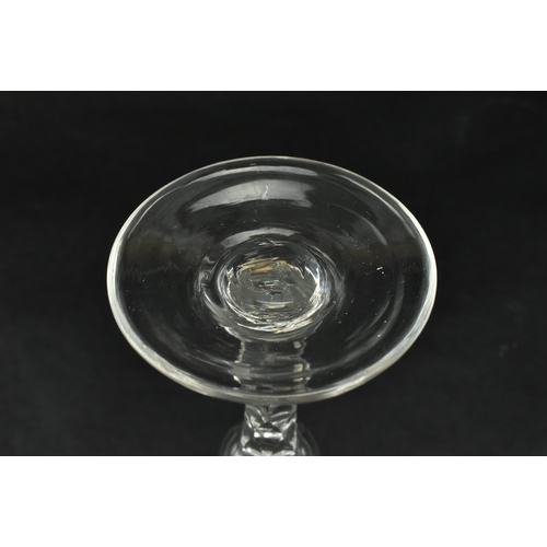 147 - A George III late 18th century hand blown ale drinking glass. The glass having a funnel bowl with et... 