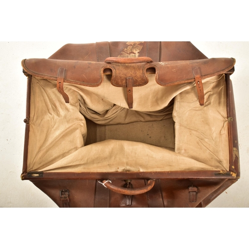 153 - A Victorian large 19th century oversized gladstone bag with leather construction and handles with st... 