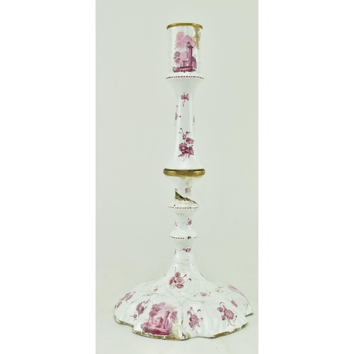 157 - A pair of mid 18th century c1765 Bilston enamel candlesticks, along with one other. The pair with pe... 