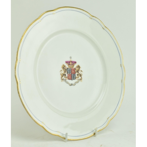 16 - A 19th century continental coat of arms dessert plate. The plate having a gilt rim with inner blue b... 