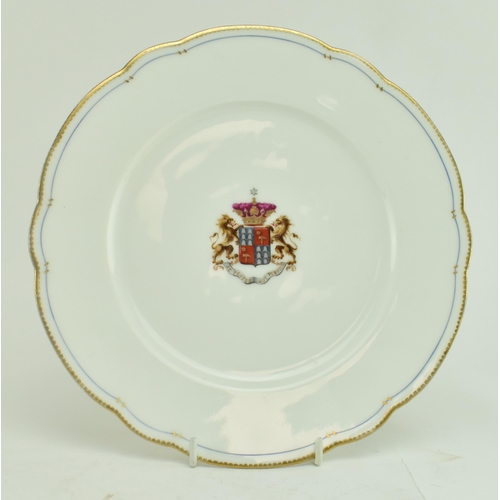 16 - A 19th century continental coat of arms dessert plate. The plate having a gilt rim with inner blue b... 