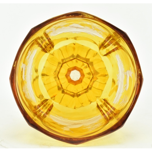 168 - Bohemian Glass - A late 19th century amber cut glass pedestal goblet cup. The goblet with a faceted ... 