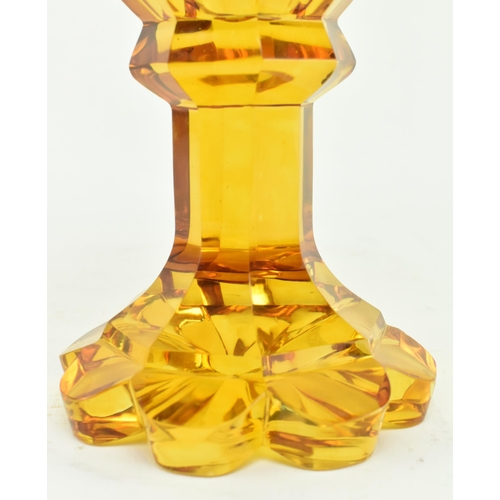 168 - Bohemian Glass - A late 19th century amber cut glass pedestal goblet cup. The goblet with a faceted ... 