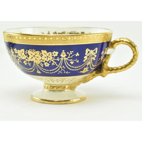 17 - Brown Westhead & Moore - Cauldon - A set of four trio sets of gilt and cobalt blue tea cups and sauc... 