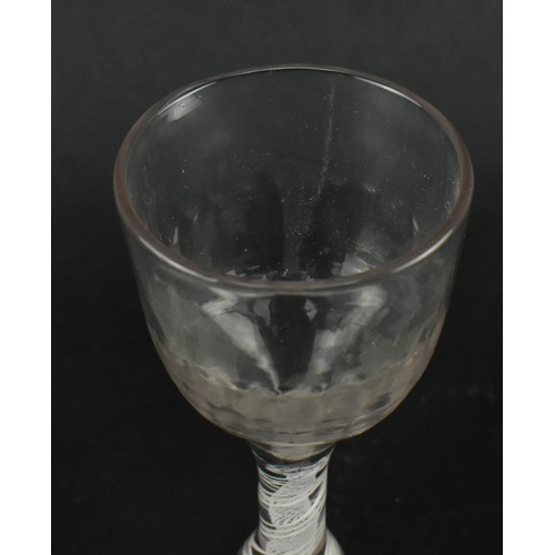 181 - A 18th century George III circa 1765 rib moulded opaque twin twist wine drinking glass. The glass ha... 