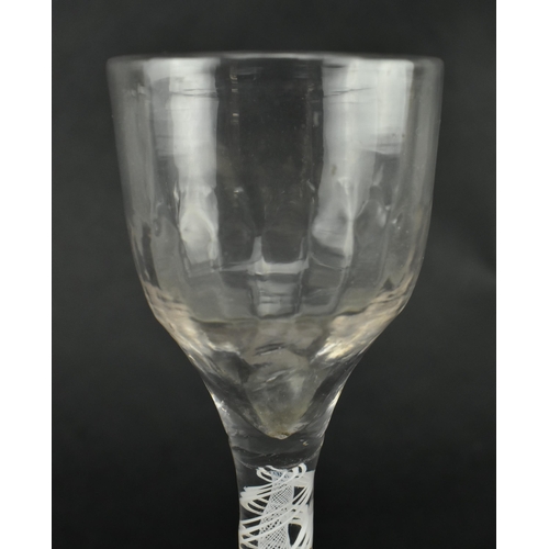 181 - A 18th century George III circa 1765 rib moulded opaque twin twist wine drinking glass. The glass ha... 