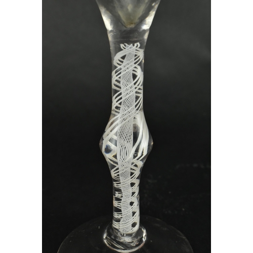 181 - A 18th century George III circa 1765 rib moulded opaque twin twist wine drinking glass. The glass ha... 