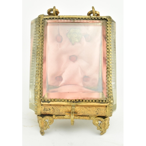 183 - A Victorian 19th century gilt metal & bevelled glass pocket watch casket case on feet. The casket wi... 