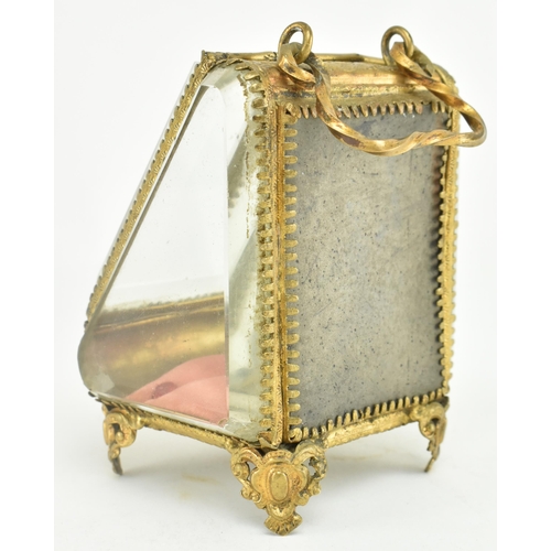 183 - A Victorian 19th century gilt metal & bevelled glass pocket watch casket case on feet. The casket wi... 