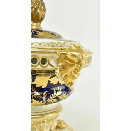 19 - Royal Crown Derby - An early 19th century 1806-1825 cobalt & gilt ceramic potpourri bowl on foot. Th... 