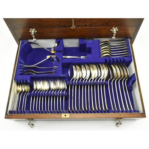 192 - Viner's Ltd of Sheffield - An early 20th century oak cased twelve people silver plated canteen of cu... 