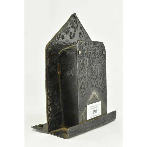 197 - A Victorian 19th century cast iron & brass house shaped money box bank. The money box having a house... 