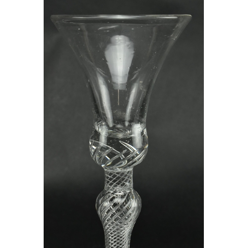 200 - An 18th century George III wine drinking glass having a bell shaped bowl with air twist stem raised ... 