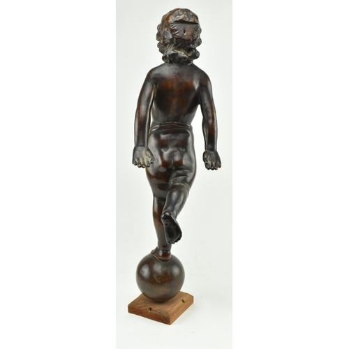 204 - A continental believed 19th century carved wood figure of cherub on globe. The cherub with arms swin... 