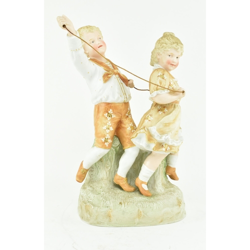 227 - Gebruder Heubach, Germany - A continental bisque ceramic figure groups of children playing. The figu... 